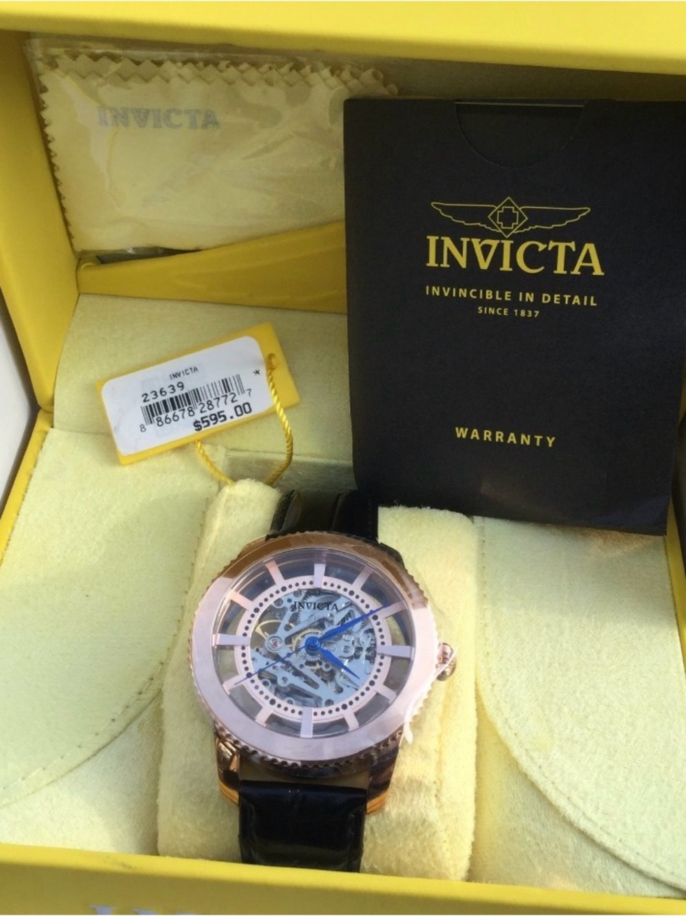 Invicta Rose Gold Skeleton Watch with Blue Hands and Black Strap